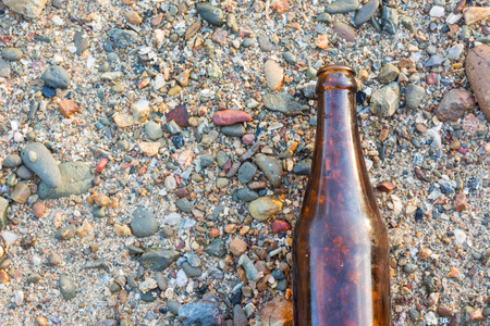 Glass bottle on group of Shell texture backgroundの写真素材