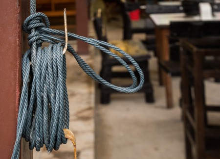 Coil of rope on a pole with blur background.の写真素材
