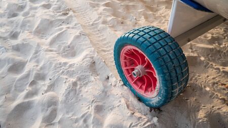the wheels on the sand backgroundの写真素材