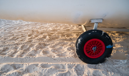 the wheels on the sand backgroundの写真素材