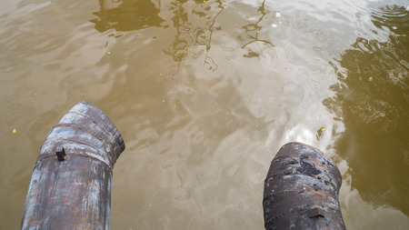 Water discharge pipe  canal in the city.の写真素材