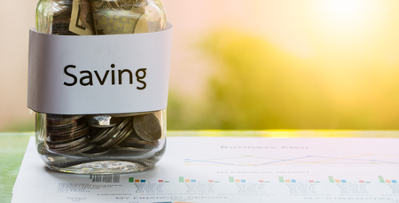 The money in the jar for savings money in bussiness, financial conceptsの写真素材