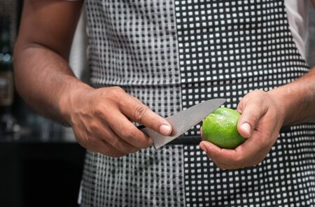 A chef are lemon peel before cooking in cooking conceptの写真素材