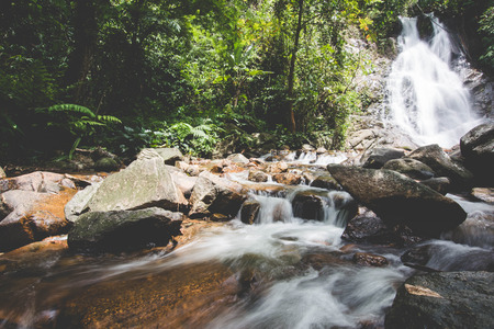  Waterfalls in the rainy season. There is a lot of water flowing into the stones. In the forests of...