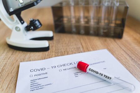 COVID19 Check List and blood test tube to detect corona virus in the lab. The corona virus outbreak...