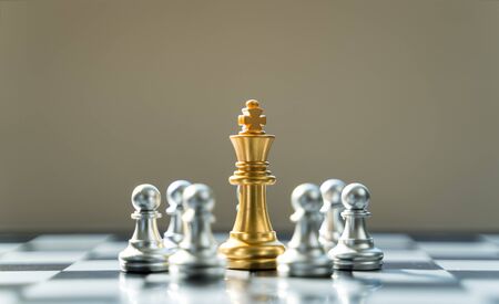 Golden King Chess is surrounded by silver chess, in conceptbusiness, triumph, success and...