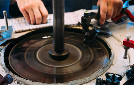 Amsterdam, Netherlands - July 2019: A skilled worker are shaping diamond they at the factory in Amsterdam, Netherlands.の写真素材