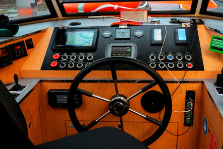 Amsterdam, Netherlands - june 2019. steering wheel and control panel for a pleasure boatの写真素材