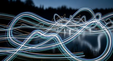 Abstract light trails on the lake at night. Long exposure photo.の素材