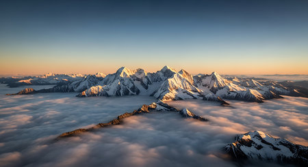 Mountain range in the clouds at sunrise. Panoramic view.の素材