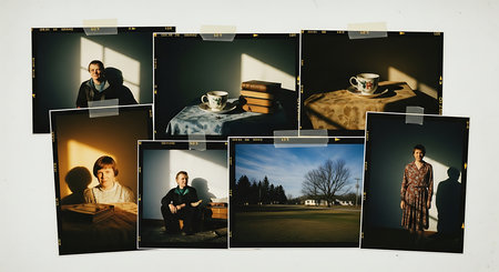 Photo album with pictures of family on the background of the park.の素材