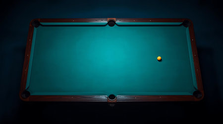 Billiard table with green cloth and billiard balls in dark roomの素材