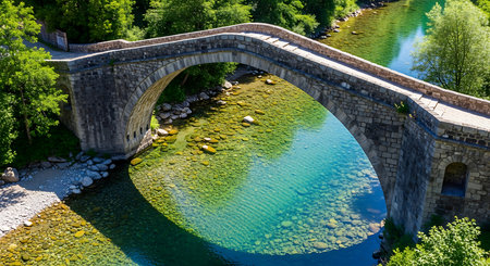 Old stone bridge over the river in the national park Sumava, Czech Republicの素材