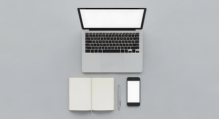 Laptop and smartphone with blank screen on white background. Top view.の素材