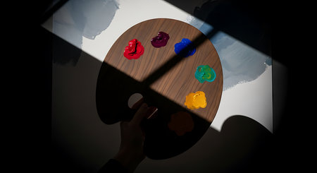 Palette with paints in hand on dark background. 3D renderingの素材