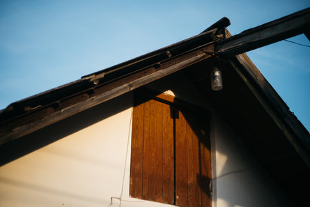 Wooden roof of a house in the countryside in the evening.の写真素材
