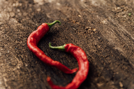 Red hot chili peppers on a wooden background. Close-up.の写真素材