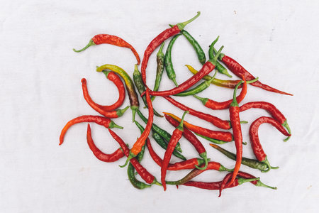 Red and green hot chili peppers on a white background, top viewの写真素材