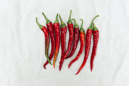 Red hot chili peppers on white background. Top view. Flat lay