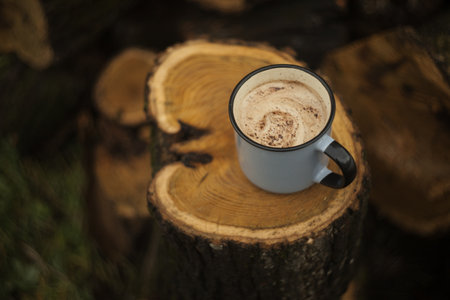 Coffee cup on a wooden stump. Cup of coffee on a wooden background.の写真素材