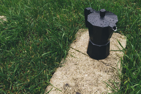 coffee maker on green grass in the park. close-upの写真素材
