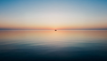 Beautiful sunset over the sea with a boat in the water - AI generatedの写真素材