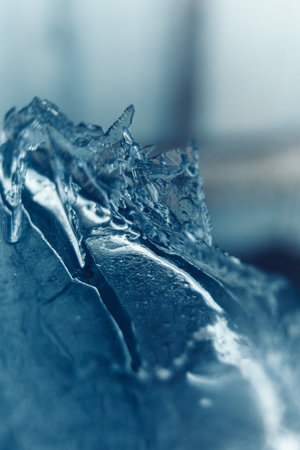 close up of ice on a frozen lake, blue toned imageの写真素材