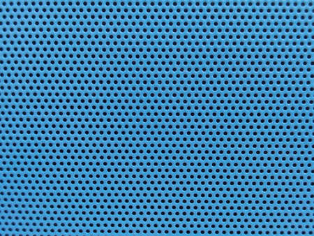 hole on blue plastic surfaceの写真素材