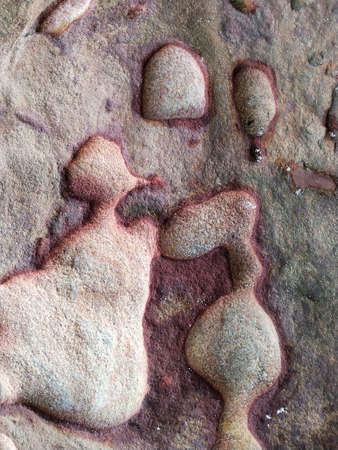 Footprint on the rock, close-up. Abstract background.