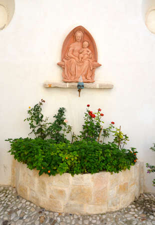 Relief of the Madonna with floral decorationの写真素材
