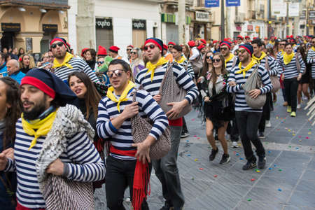 Vilanova i la Geltrú, Spain - Feb 11, 2018: members of the groups The Comparsas on The War of Candies.のeditorial素材