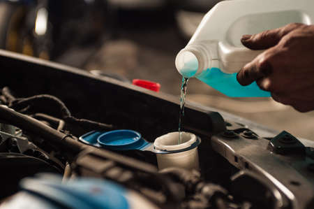 mechanic fixing a car at homeの写真素材