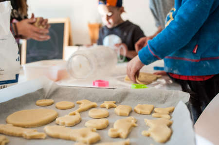 family making cookies at home