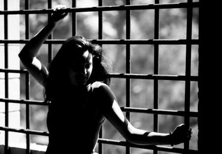 Young brunette woman in a old houseの写真素材