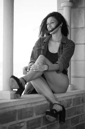 Young brunette woman in a old houseの写真素材