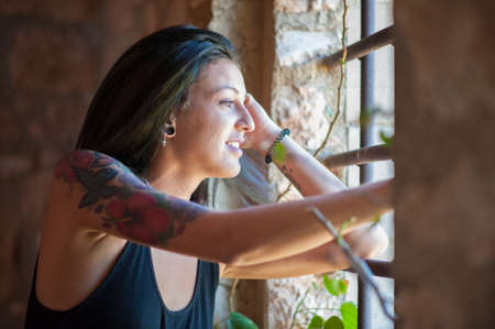 Young brunette woman in a old house