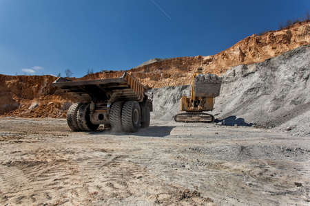 Bor, Serbia - April 15.2015 Group of tourists visiting the Open pit copper mineVeiliki Krivelj at Bor, Serbia. A close encounter with a large excavatorのeditorial素材