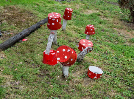 Red plastic bucket with white polka dots as decorationの写真素材