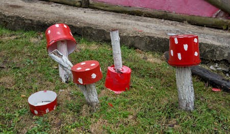 Red plastic bucket with white polka dots as decorationの写真素材