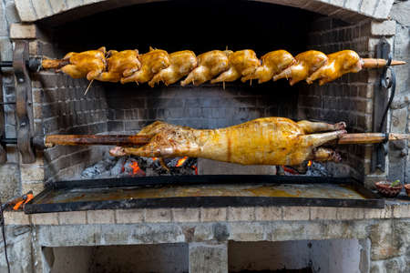 Grilled meat, pig and chicken on an outdoor barbecue