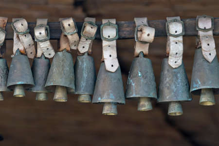 Animal bell hanging on a pole as a decorationの写真素材