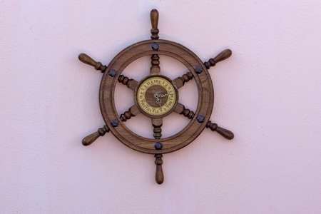 Wall clock made from boat steering hanging on the wallの写真素材