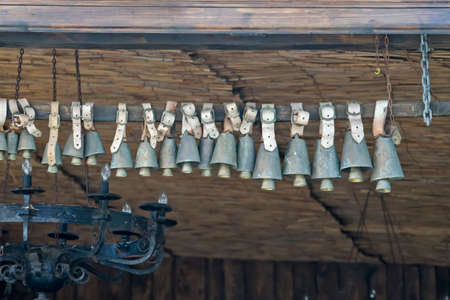 Animal bell hanging on a pole as a decorationの写真素材