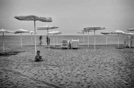 Pomorje, Bulgaria - July, 04.2012: Little boy playing in the sand at the beachのeditorial素材