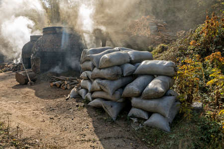 The production of charcoal in a traditional manner in the forestの写真素材