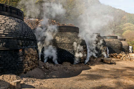 The production of charcoal in a traditional manner in the forest