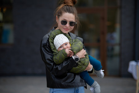Young mother with her little daughter in the city. selective focus.の写真素材