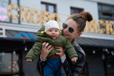 Young mother with her baby in the city. happy family concept.の写真素材