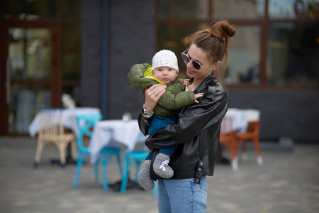 Young mother with her baby in the city. happy family concept.の写真素材