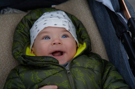 Portrait of a cute baby boy with a funny expression on his faceの写真素材